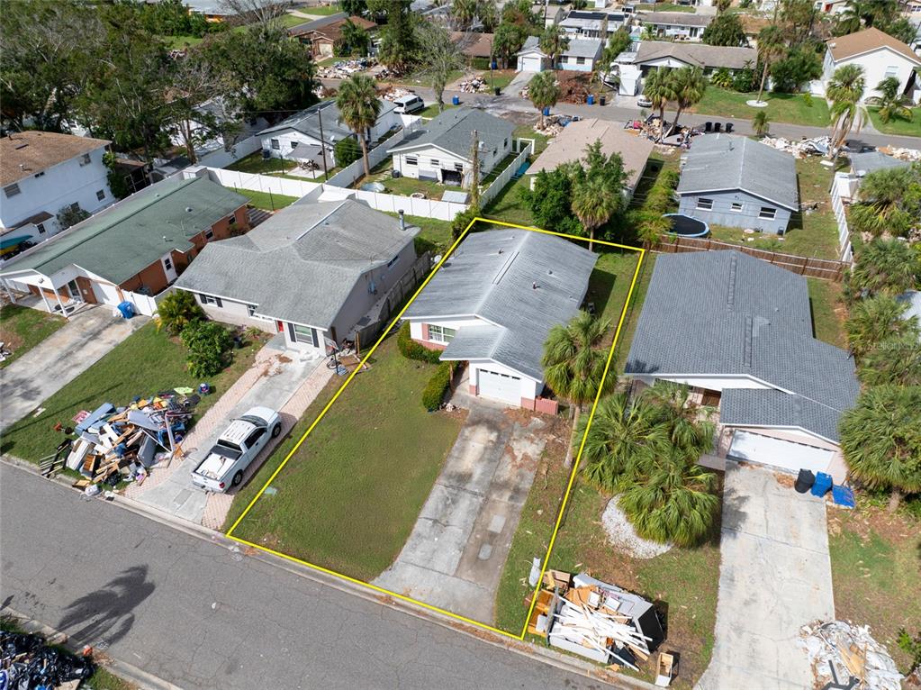 an aerial view of a residential houses with outdoor space