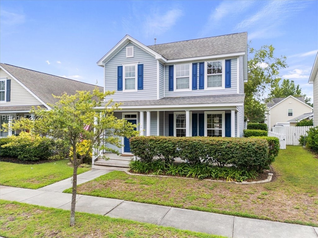 View of front of property with a front lawn