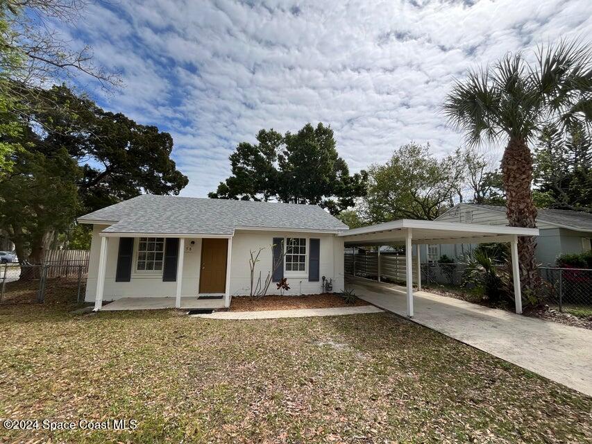 front view of a house with a yard