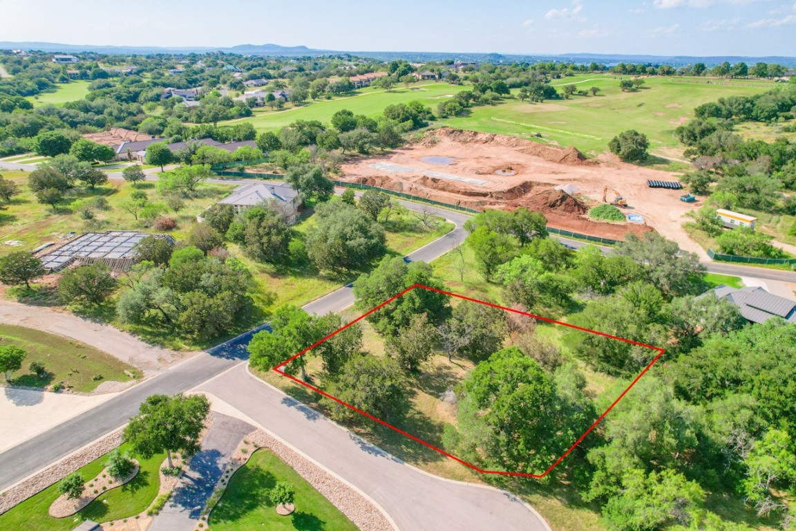 an aerial view of lake residential houses with outdoor space and swimming pool