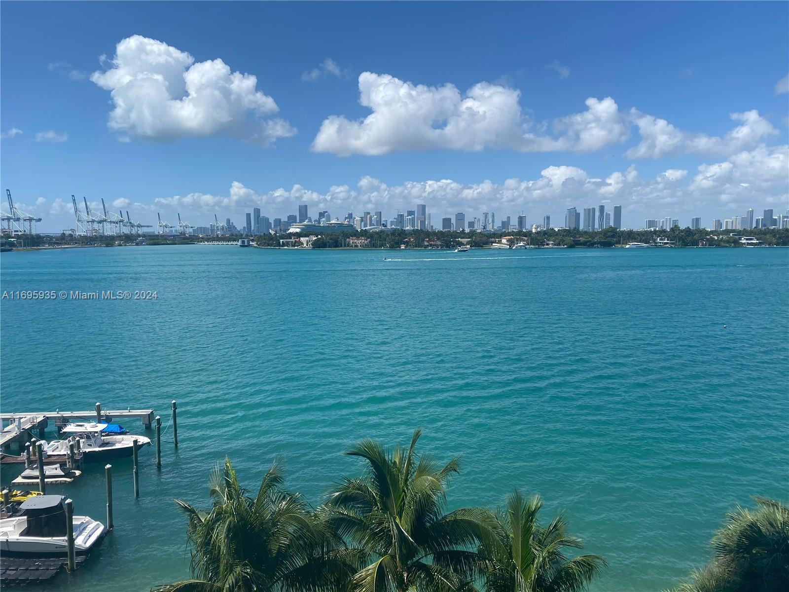 a view of a lake with a yard