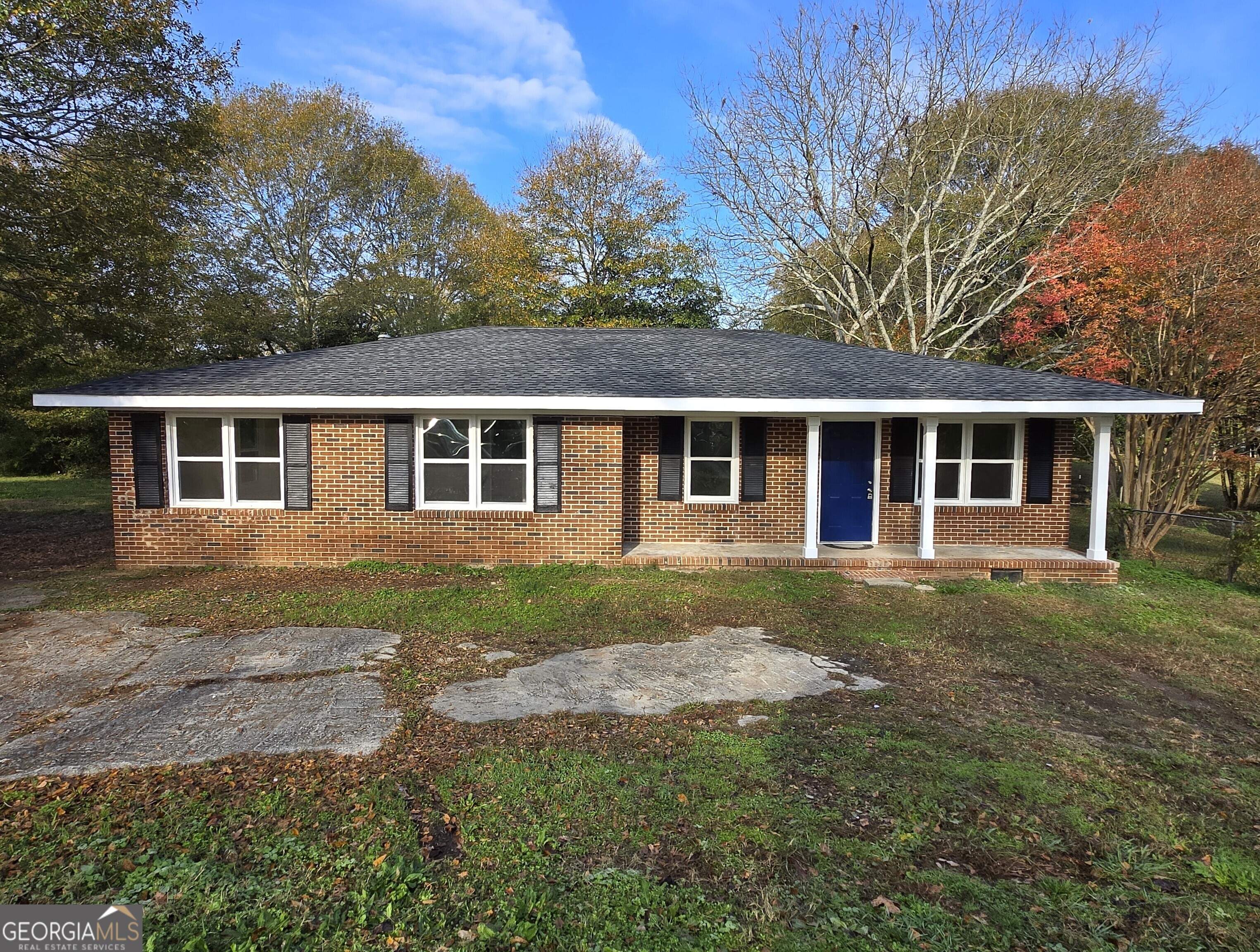 front view of a house with a yard