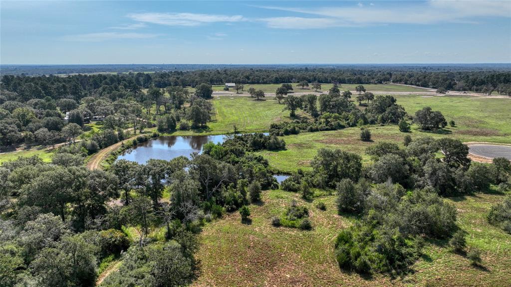 an aerial view of a houses with a lake view