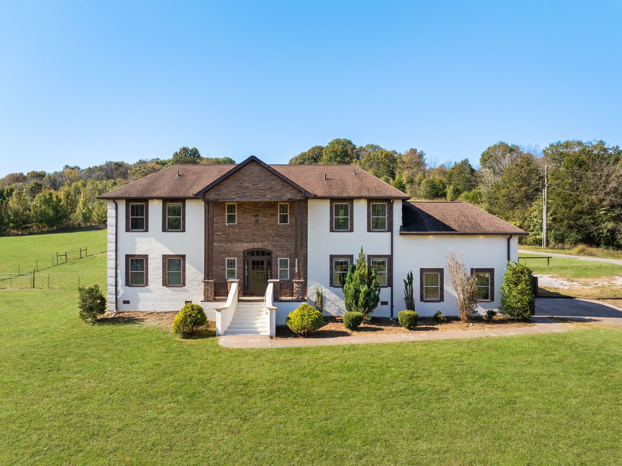 a front view of house with yard and outdoor seating