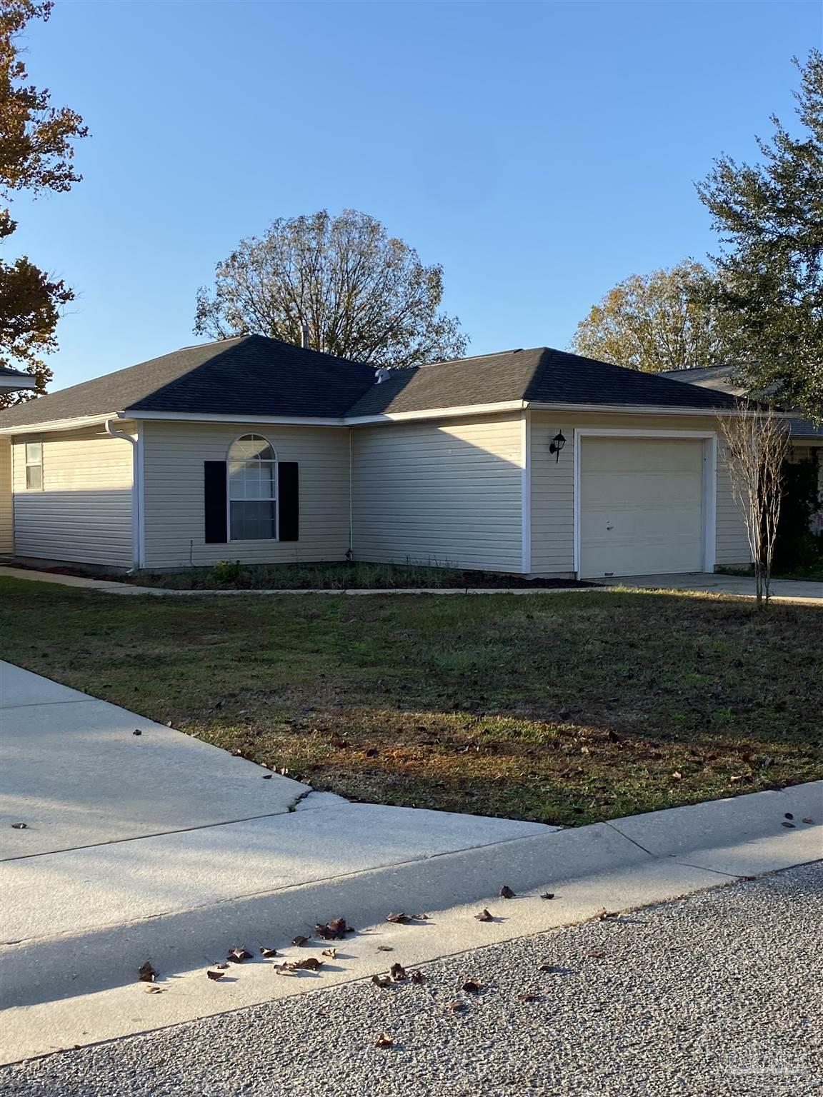 a view of a house with a yard