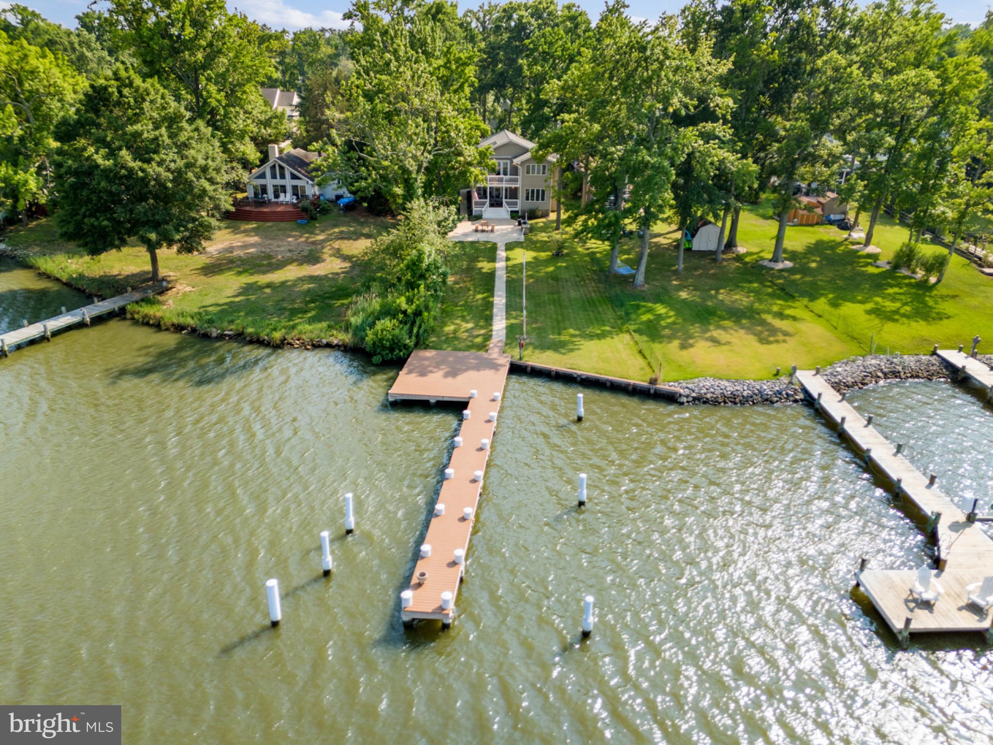 a view of a lake with a house in the background