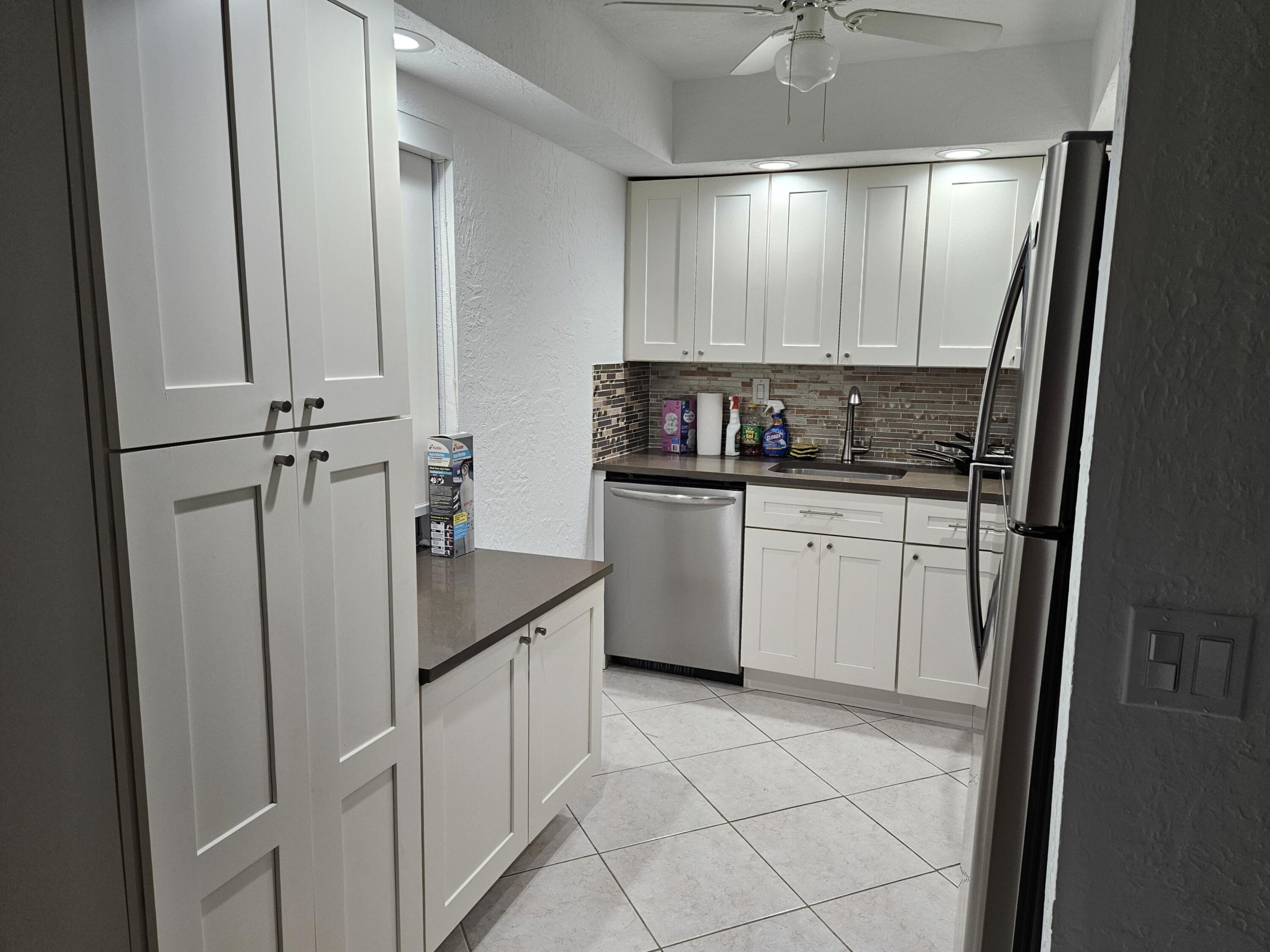 a kitchen with a sink and cabinets