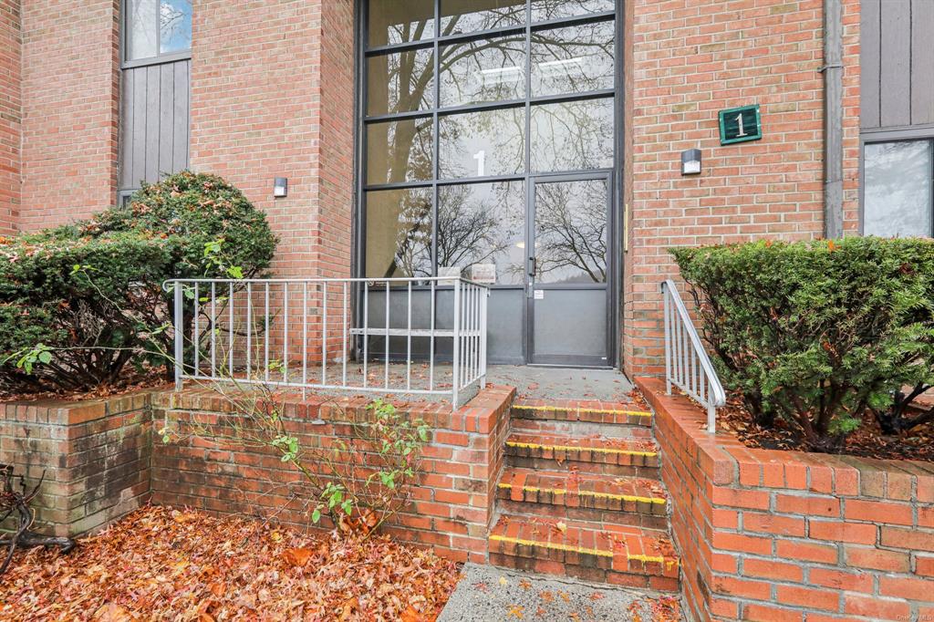 a view of a balcony with wooden floor and fence