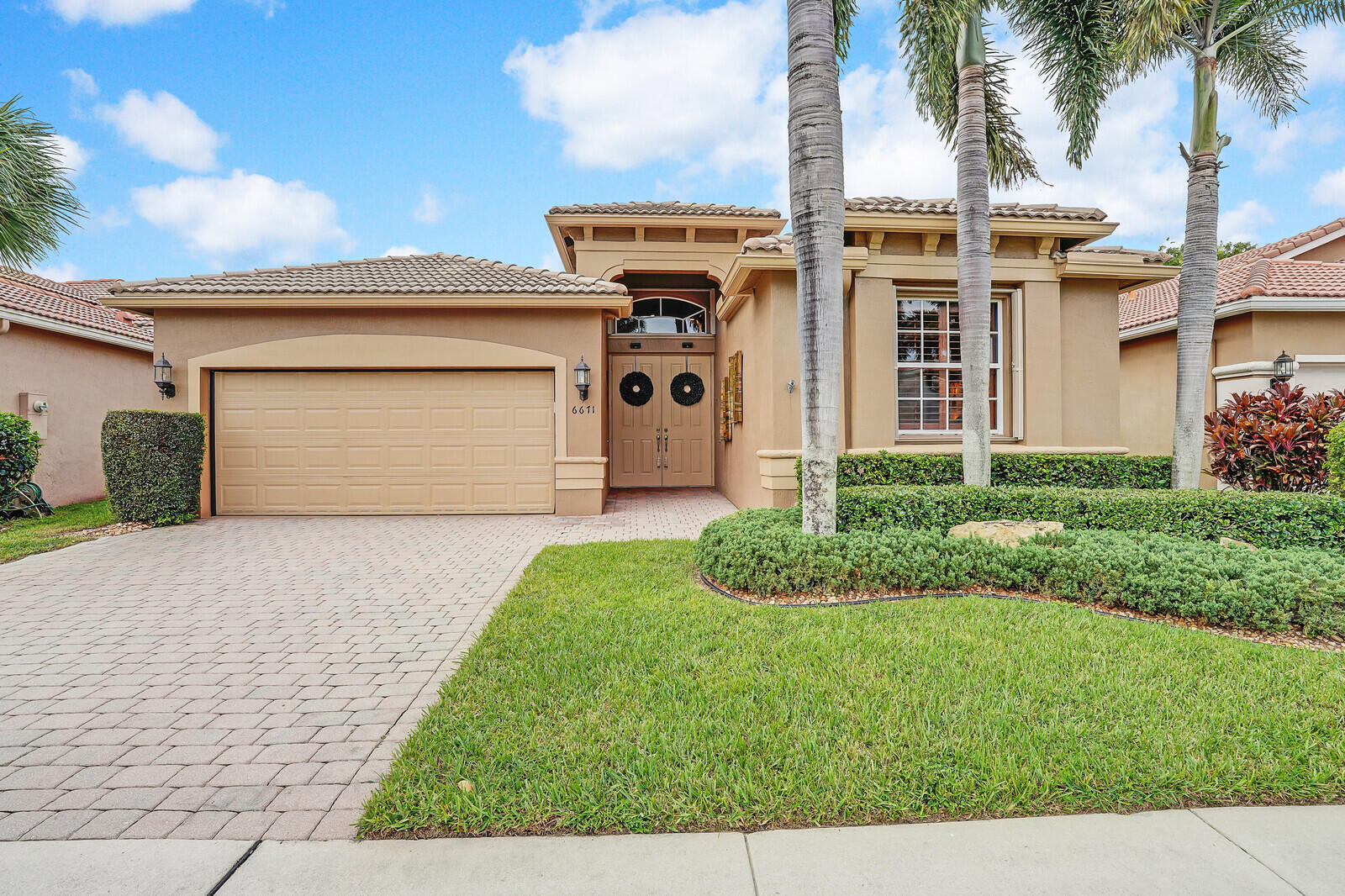 front view of a house with a yard