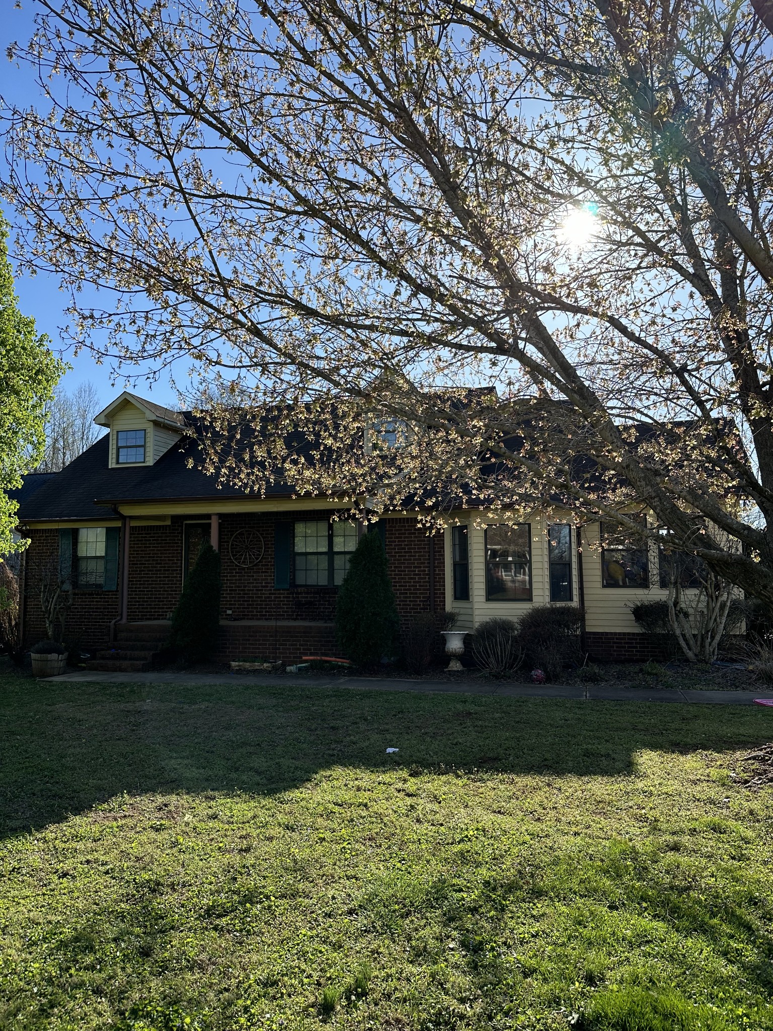 a front view of a house with garden