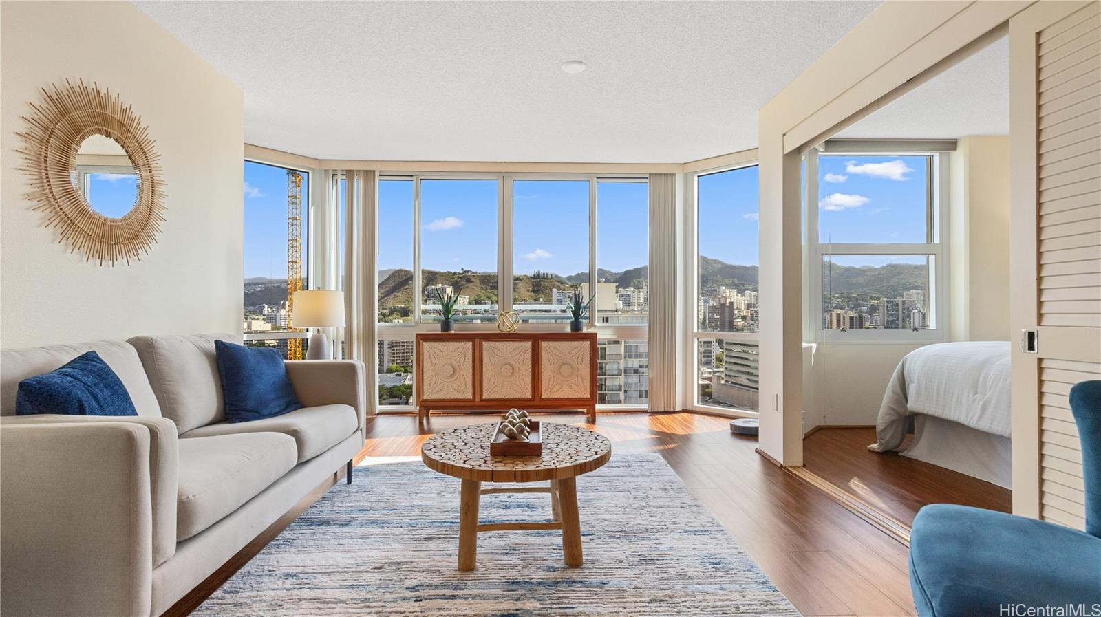 a living room with furniture and a large window