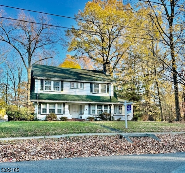 a view of a brick building next to a yard