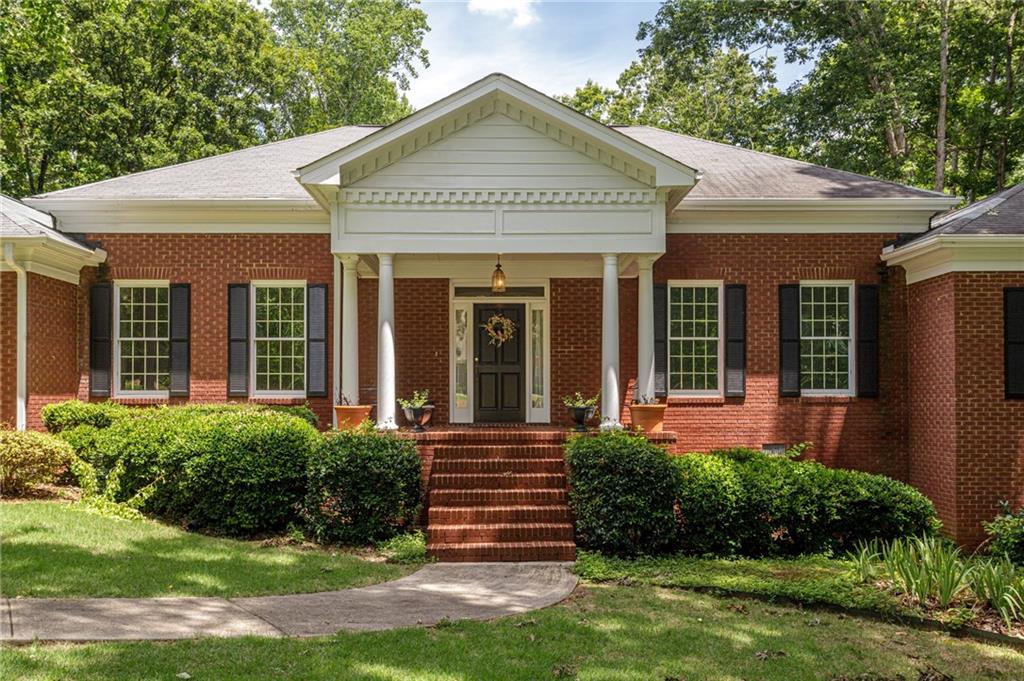 front view of a house with a yard