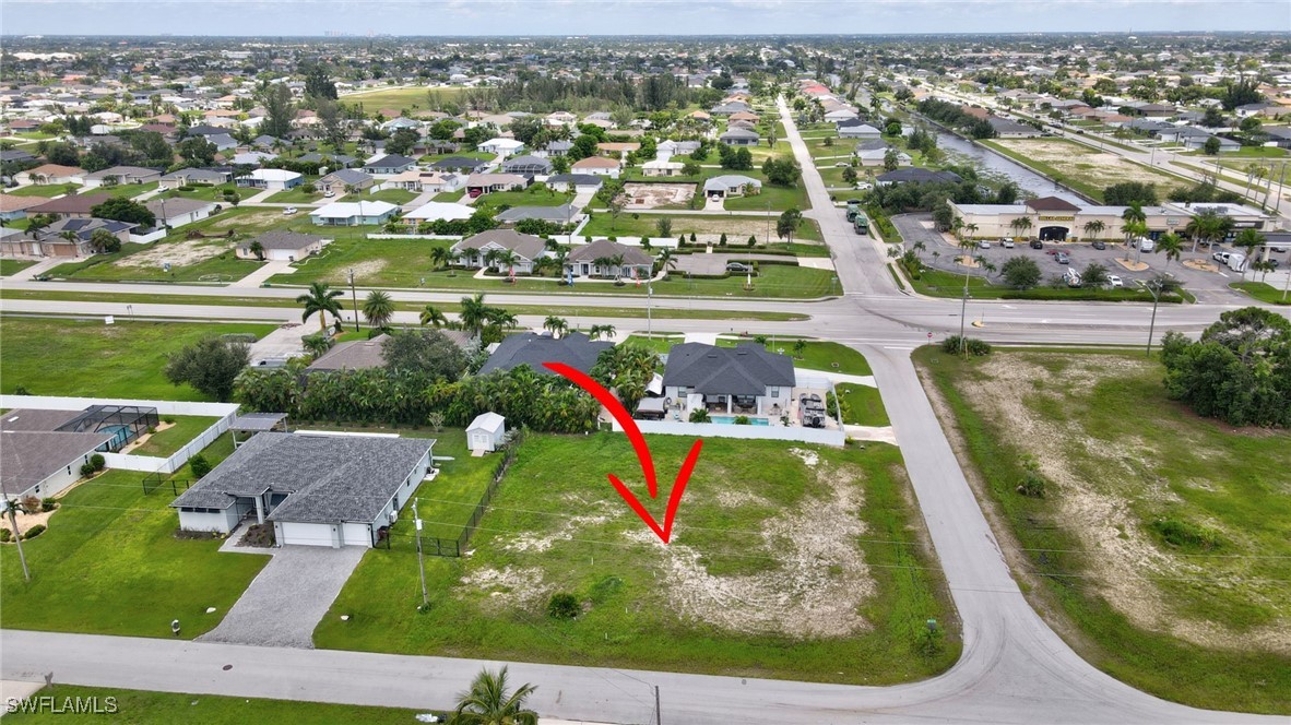 an aerial view of a residential houses with outdoor space