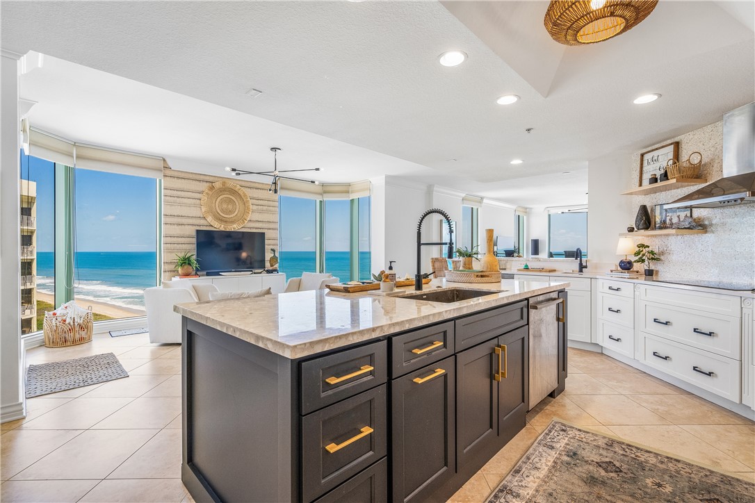 a kitchen with counter top space sink and stove