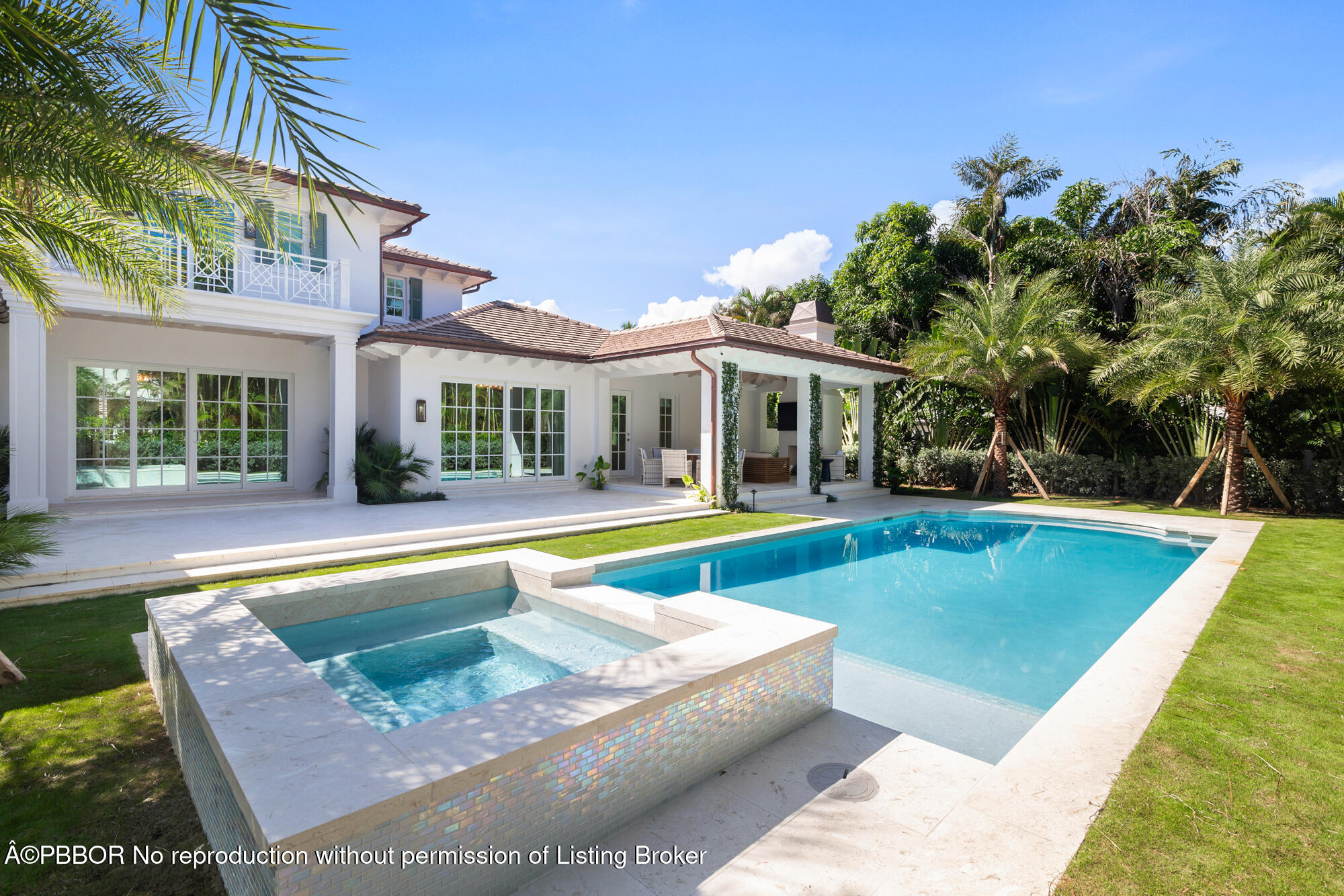 a view of house with swimming pool and a yard