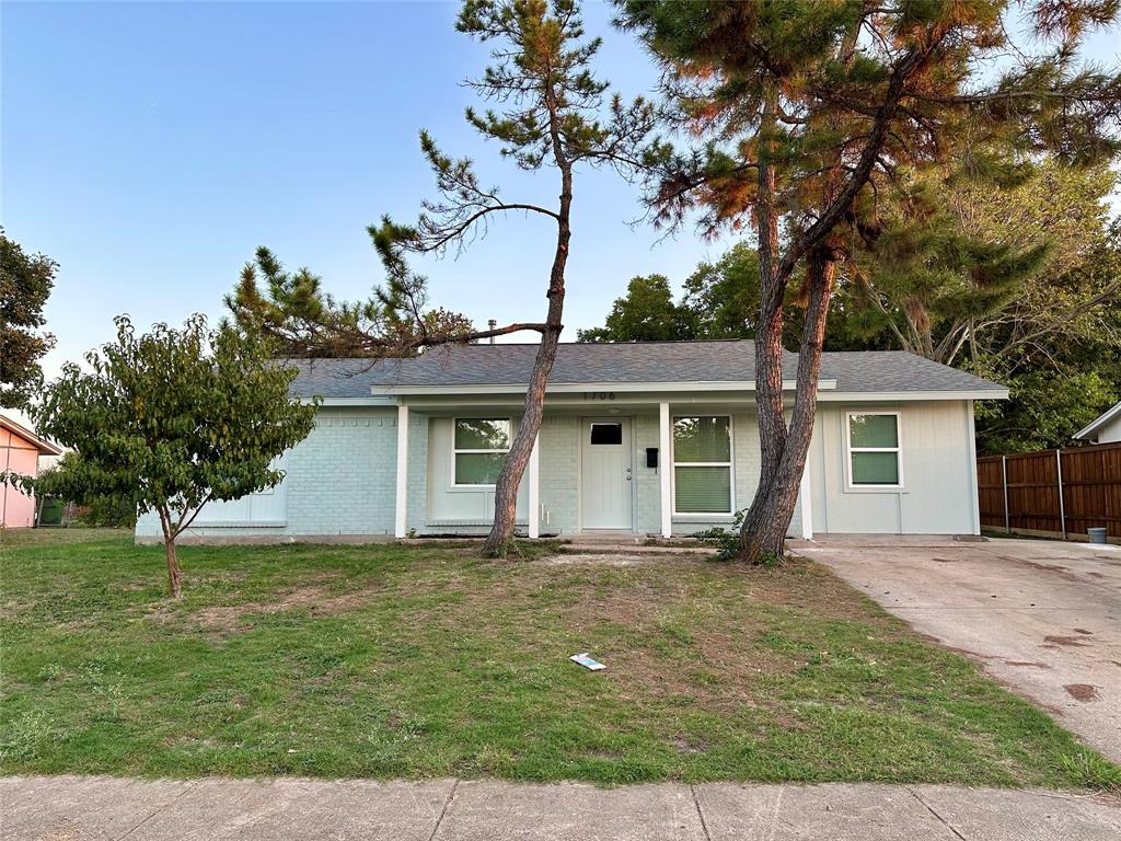 front view of a house with a yard