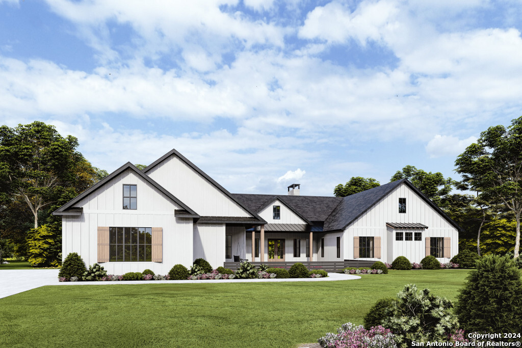 a front view of house with yard and green space