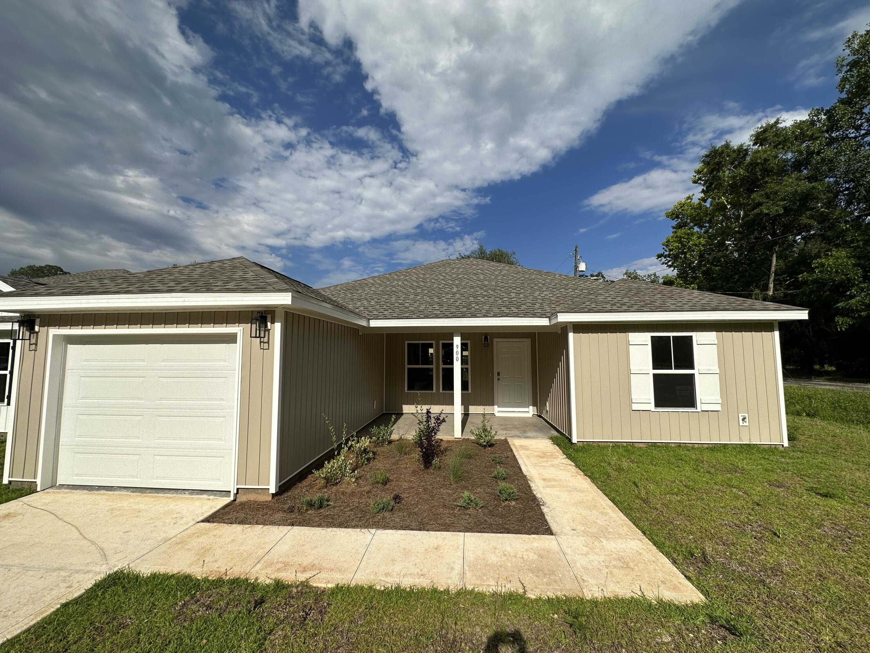 front view of a house with a yard