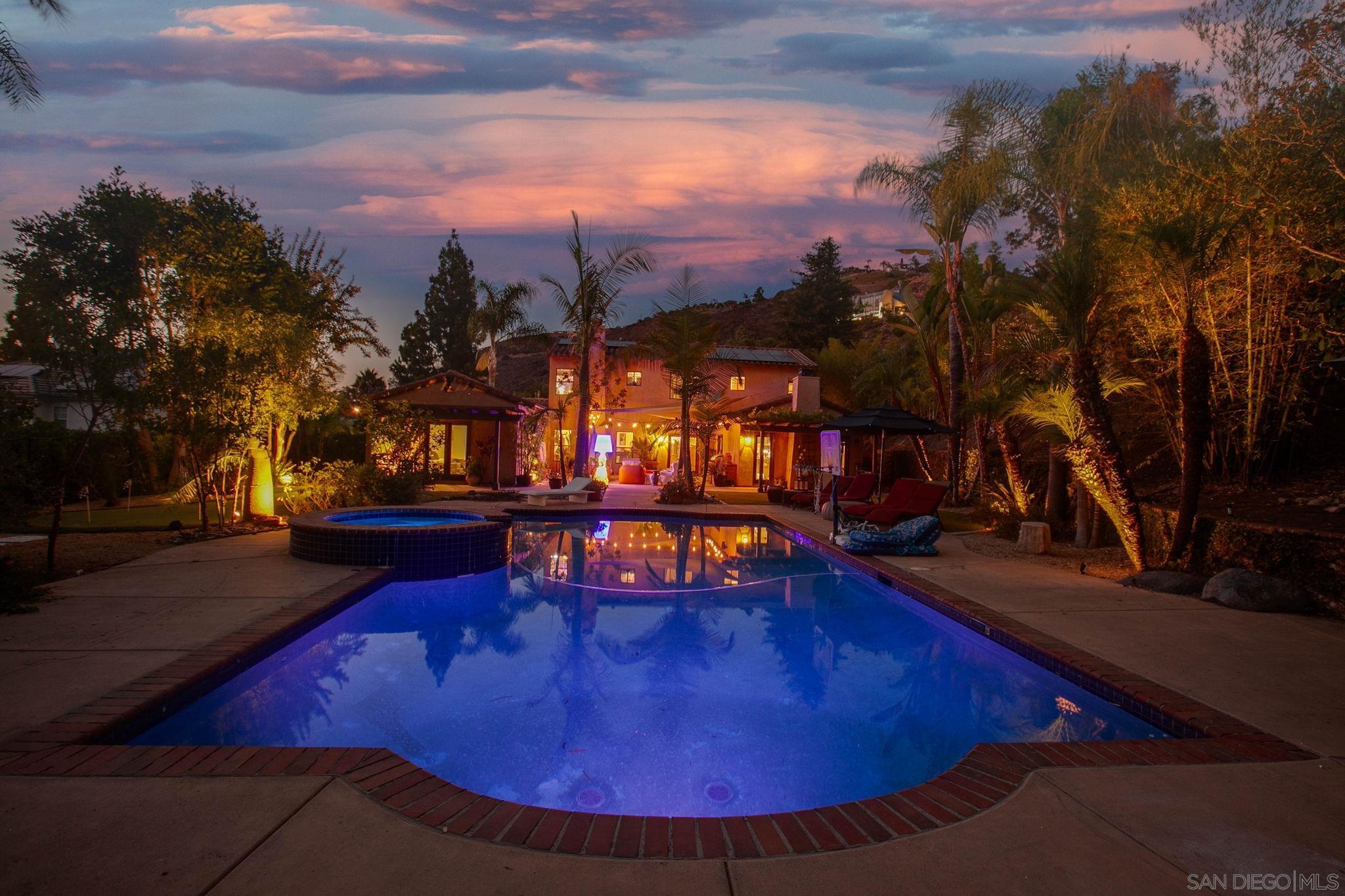 a view of a swimming pool with an outdoor seating