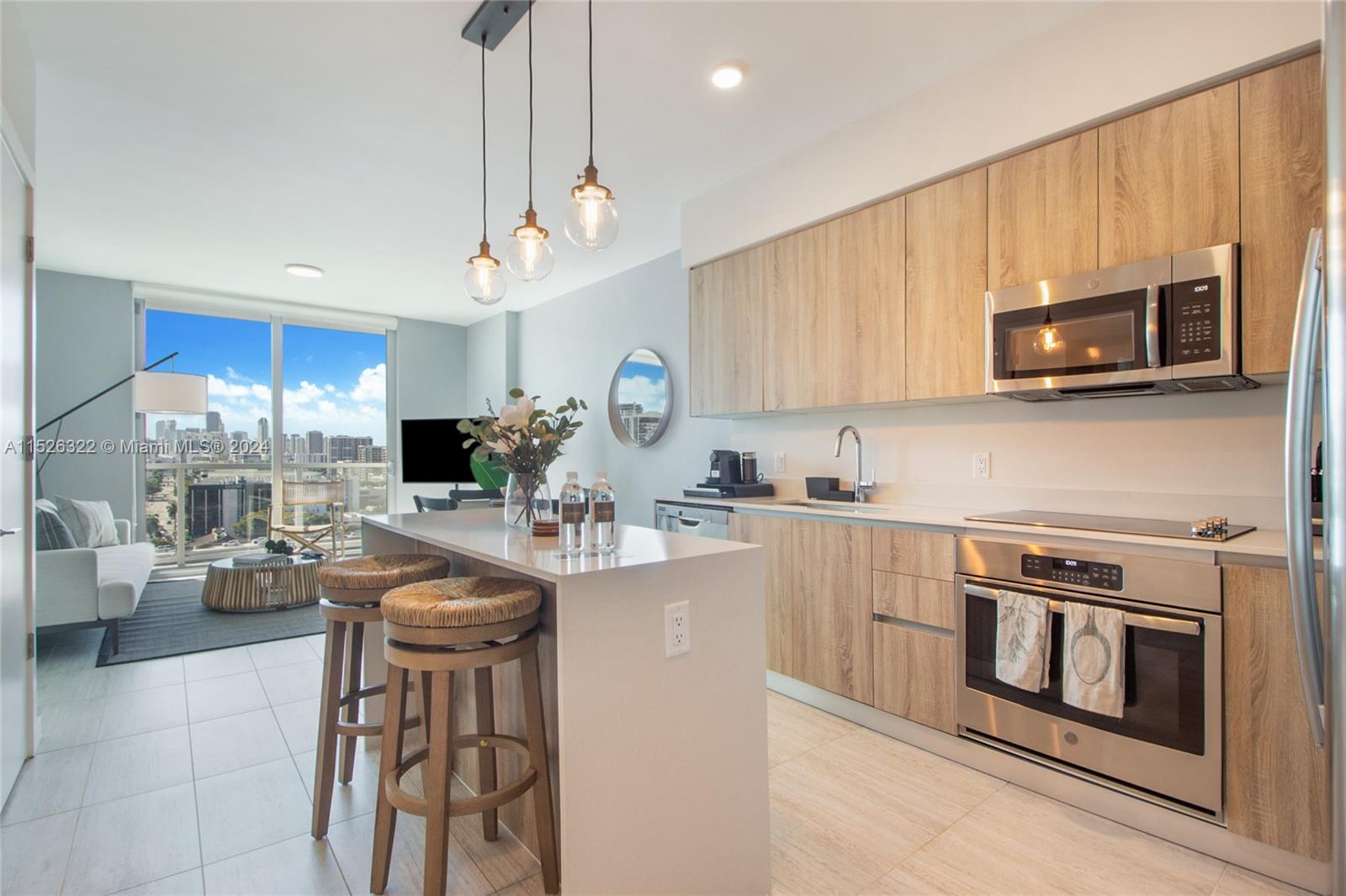 a kitchen with stainless steel appliances a stove a sink and cabinets