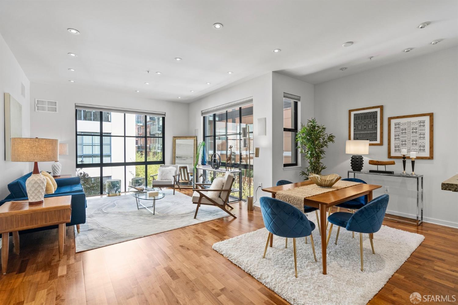 a living room with fireplace furniture and a large window