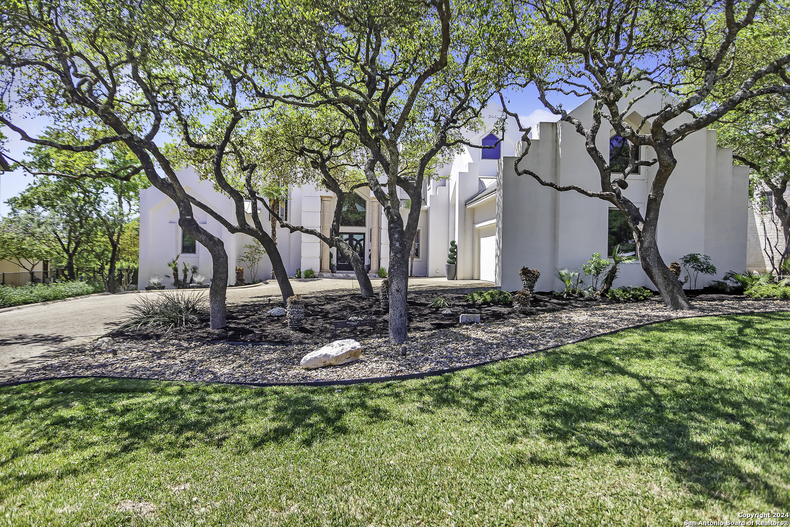 a backyard of a house with lots of green space