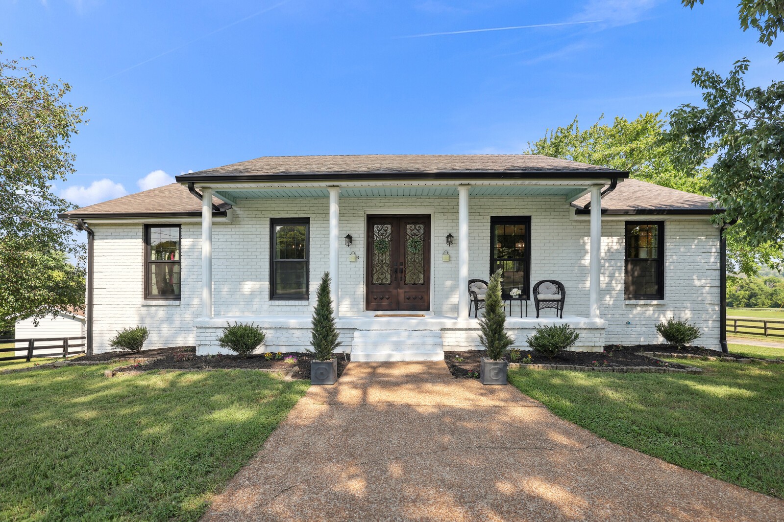 a front view of a house with a yard