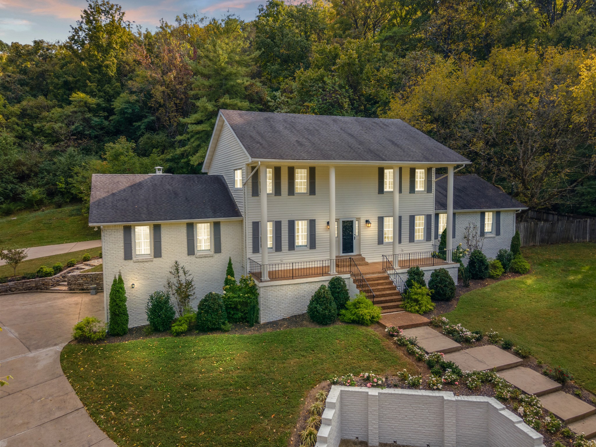 a front view of a house with garden