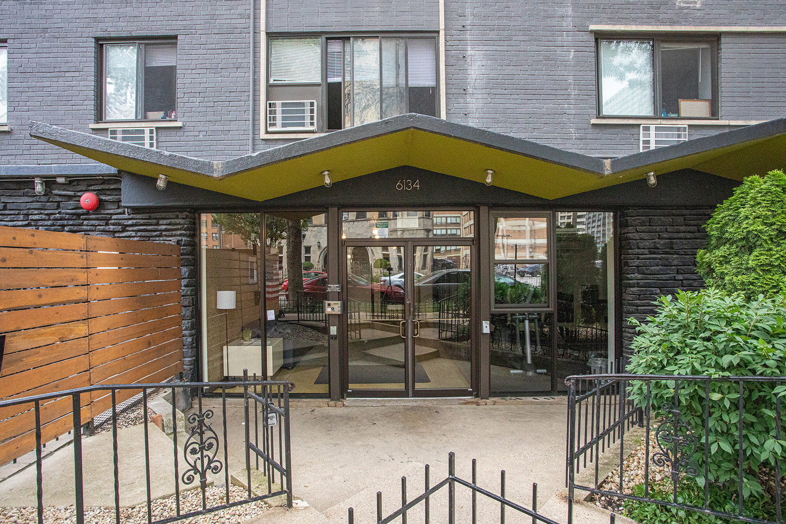 a view of a building with sitting area