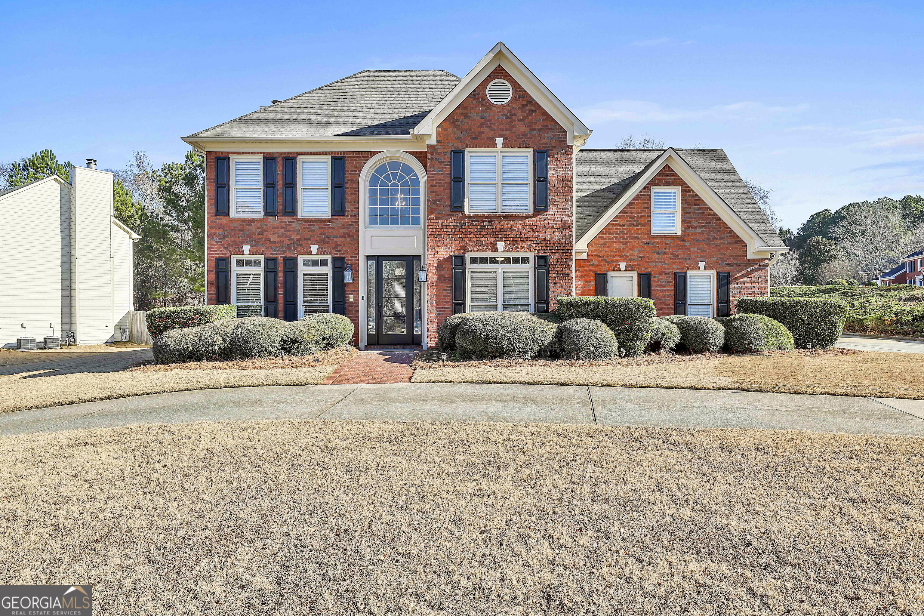 a front view of a house with a yard