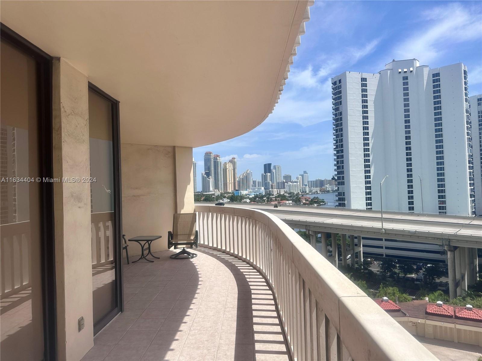 a view of balcony with furniture