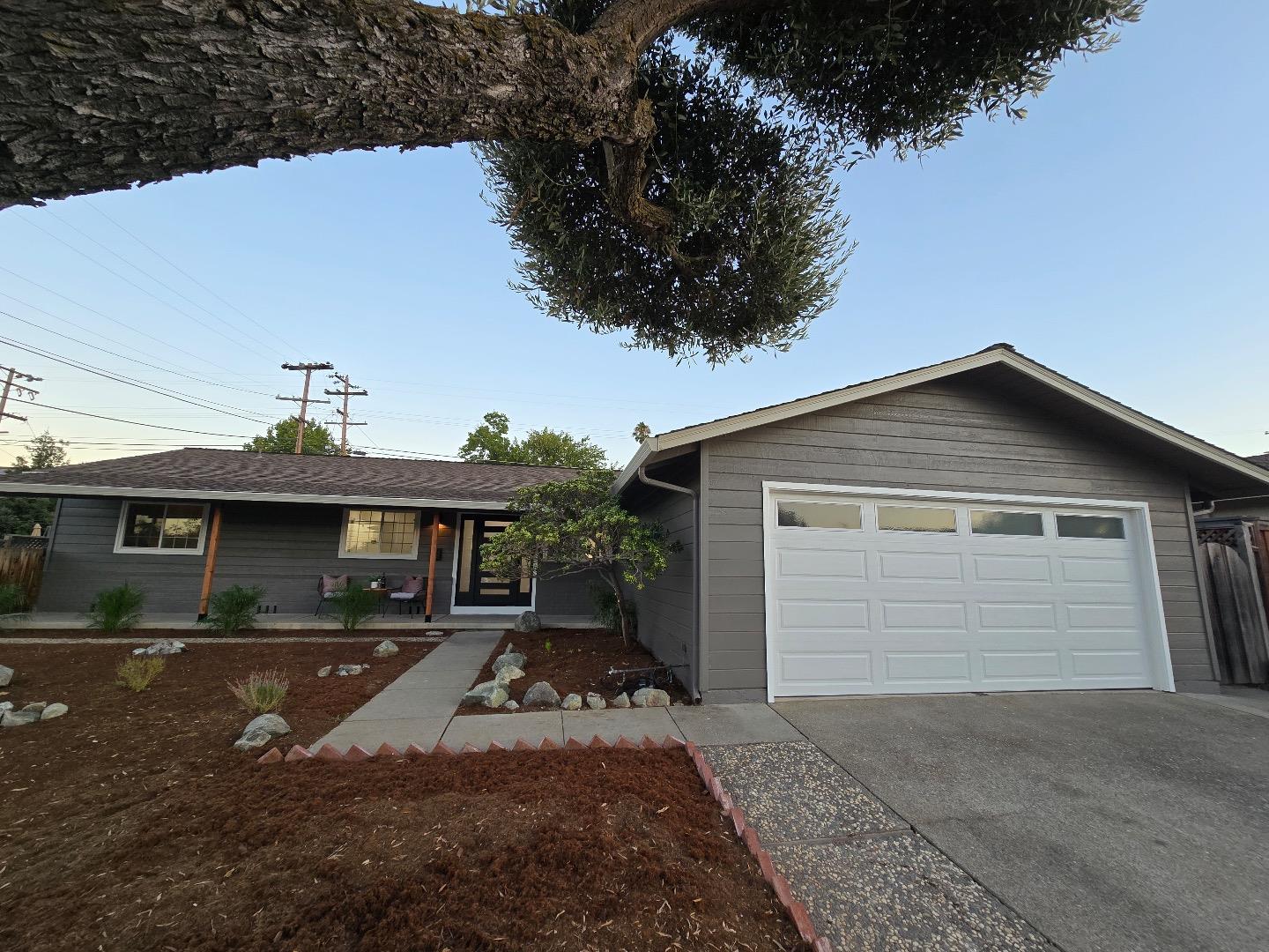 a front view of a house with yard