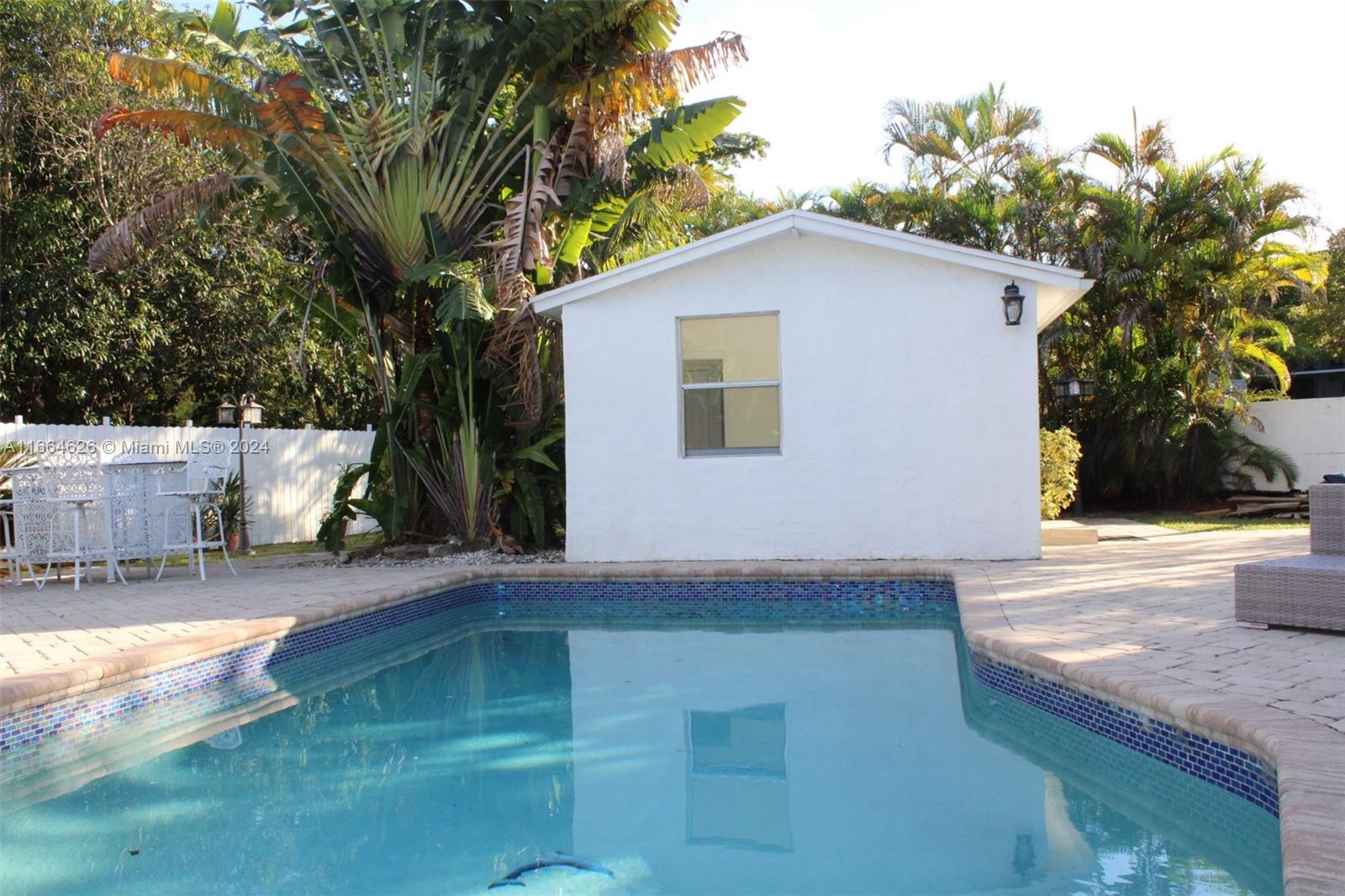 a view of a backyard of the house