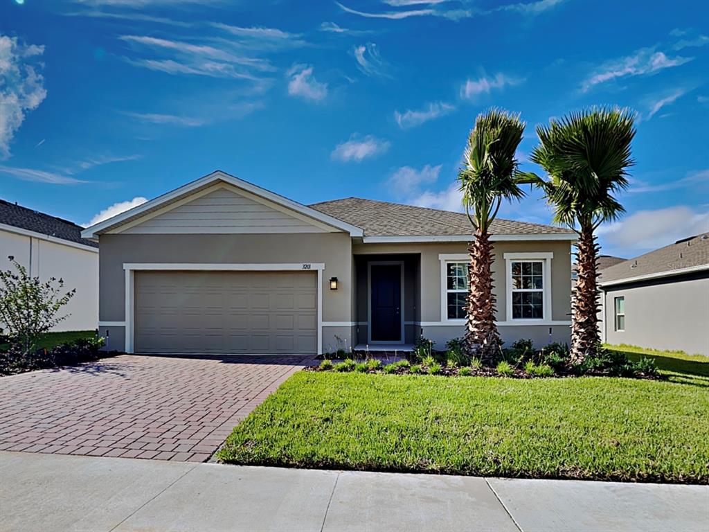 front view of a house with a small yard