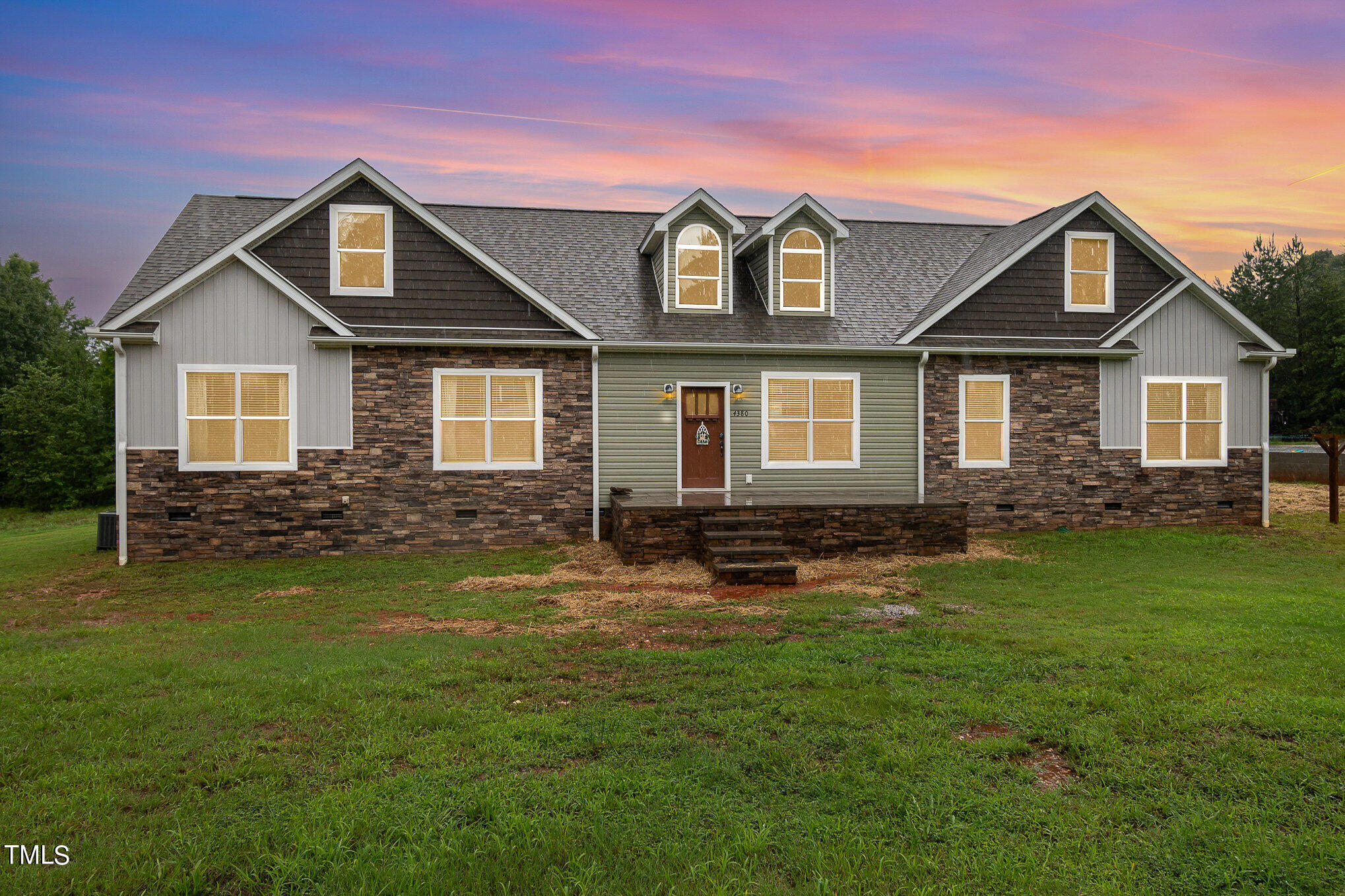 front view of a house with a yard