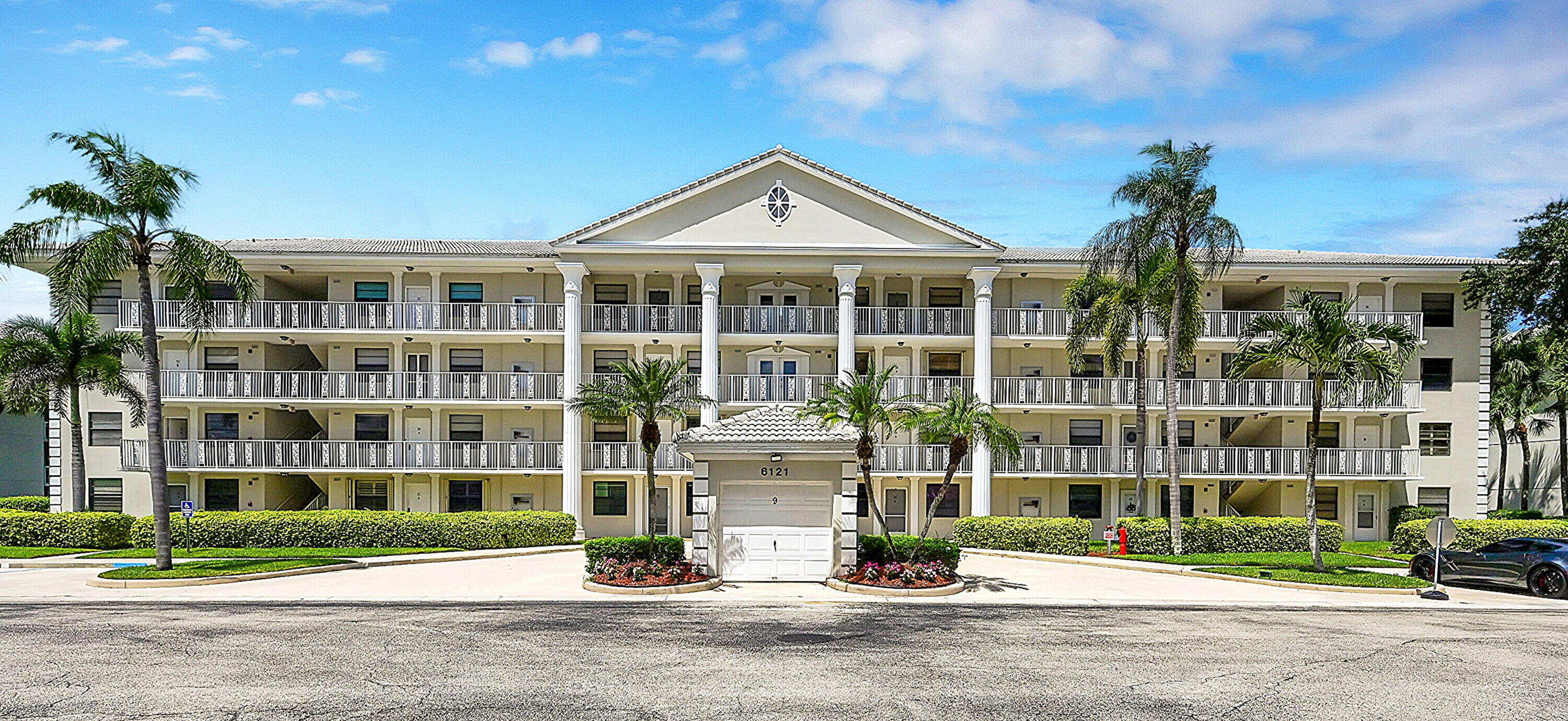 a front view of building with yard