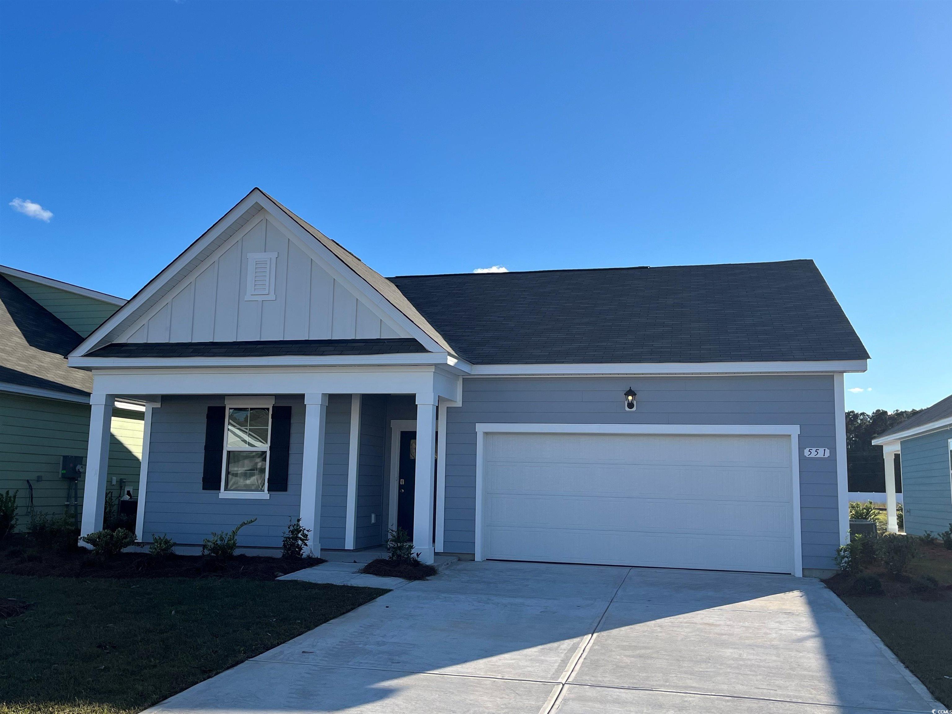 View of front of home featuring a garage