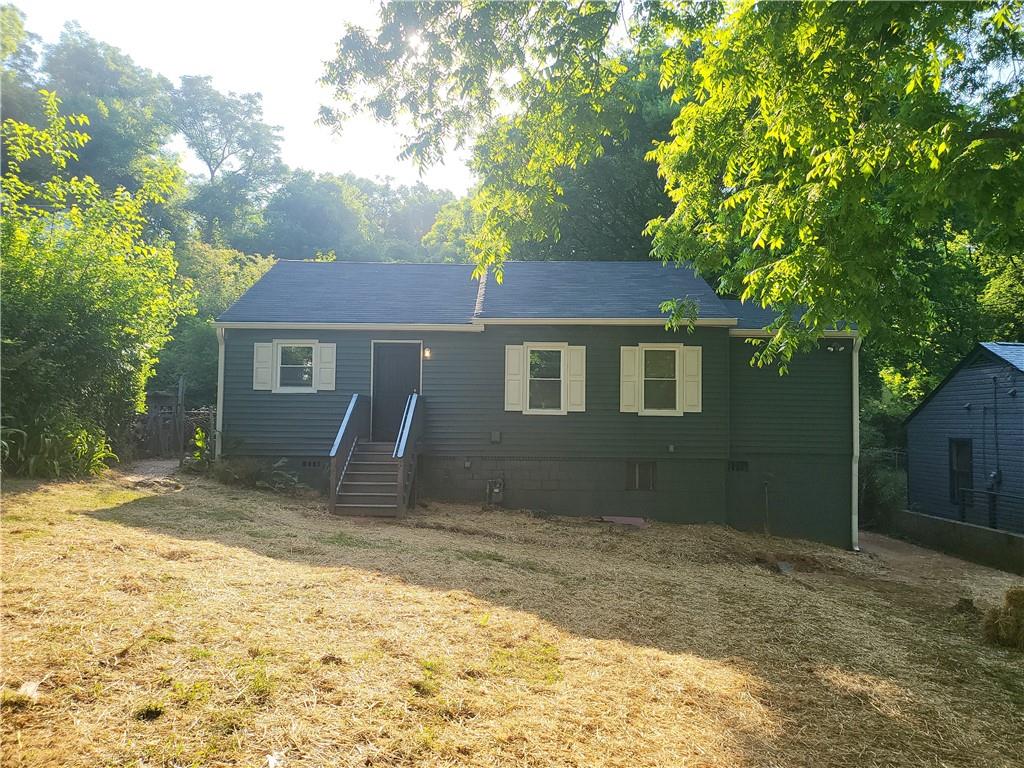 a house with trees in the background