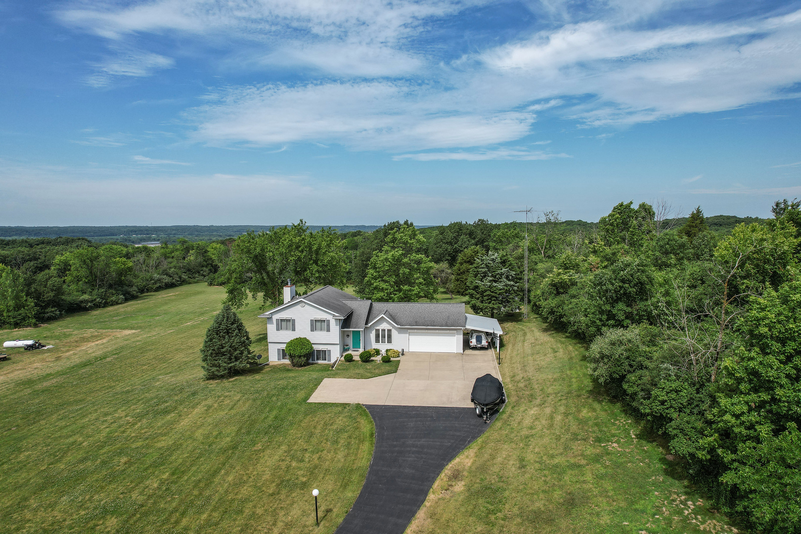 a view of a house with a big yard