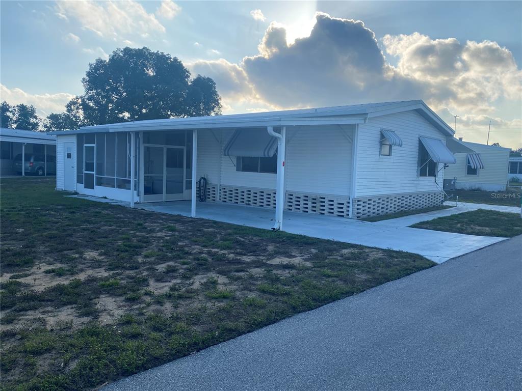 Corner lot with carport on each side of home.