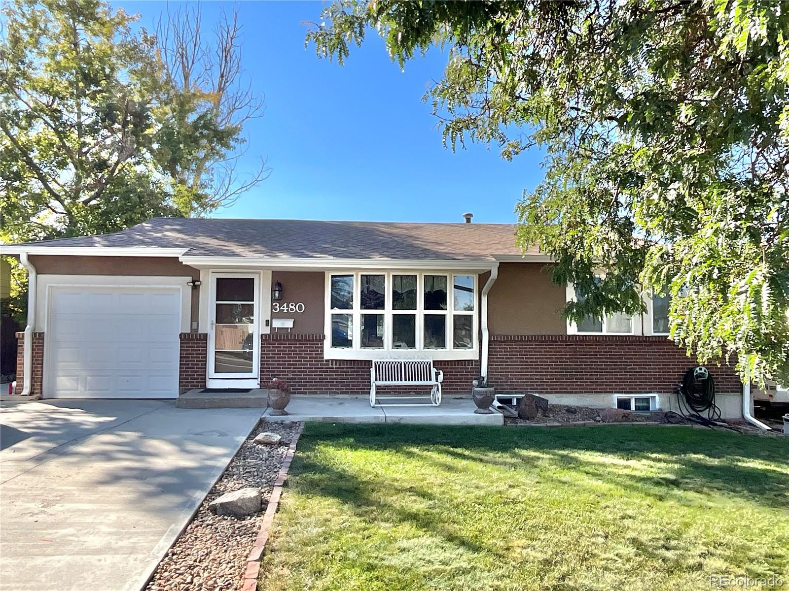 front view of a house with a yard