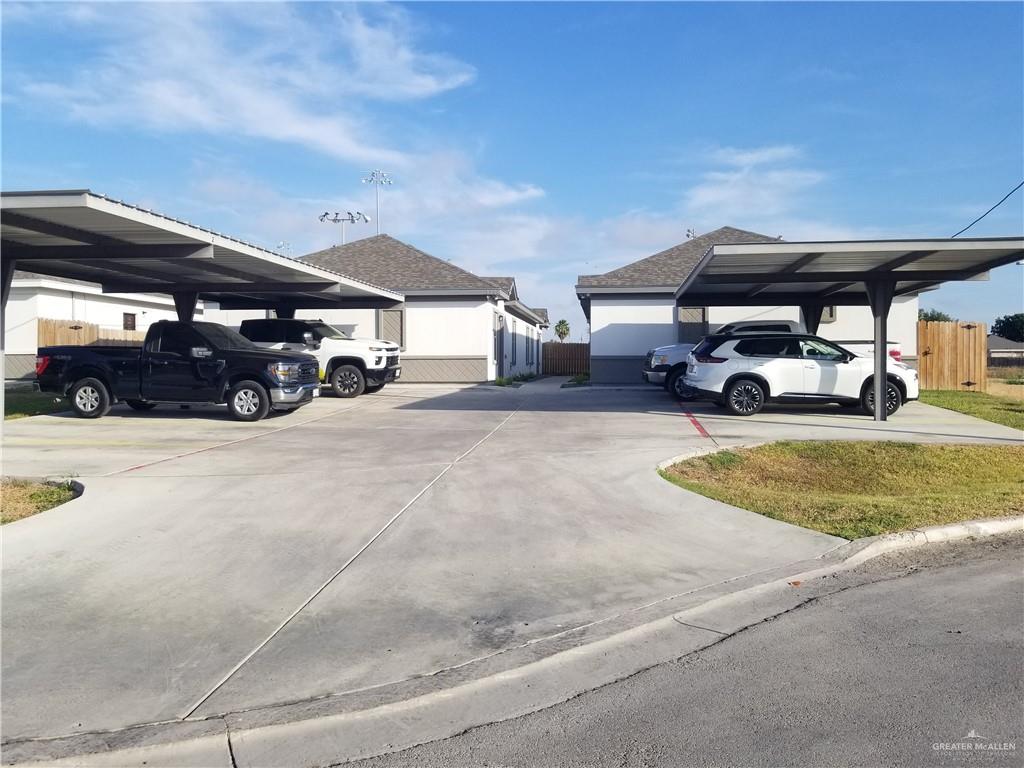 a view of a car park in front of house