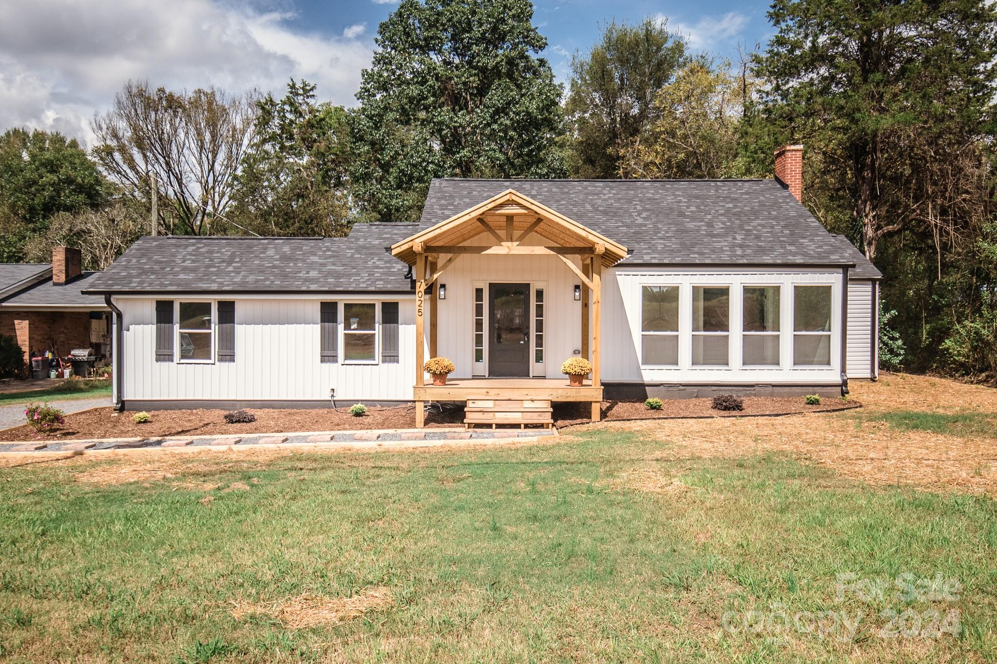 a front view of a house with a yard