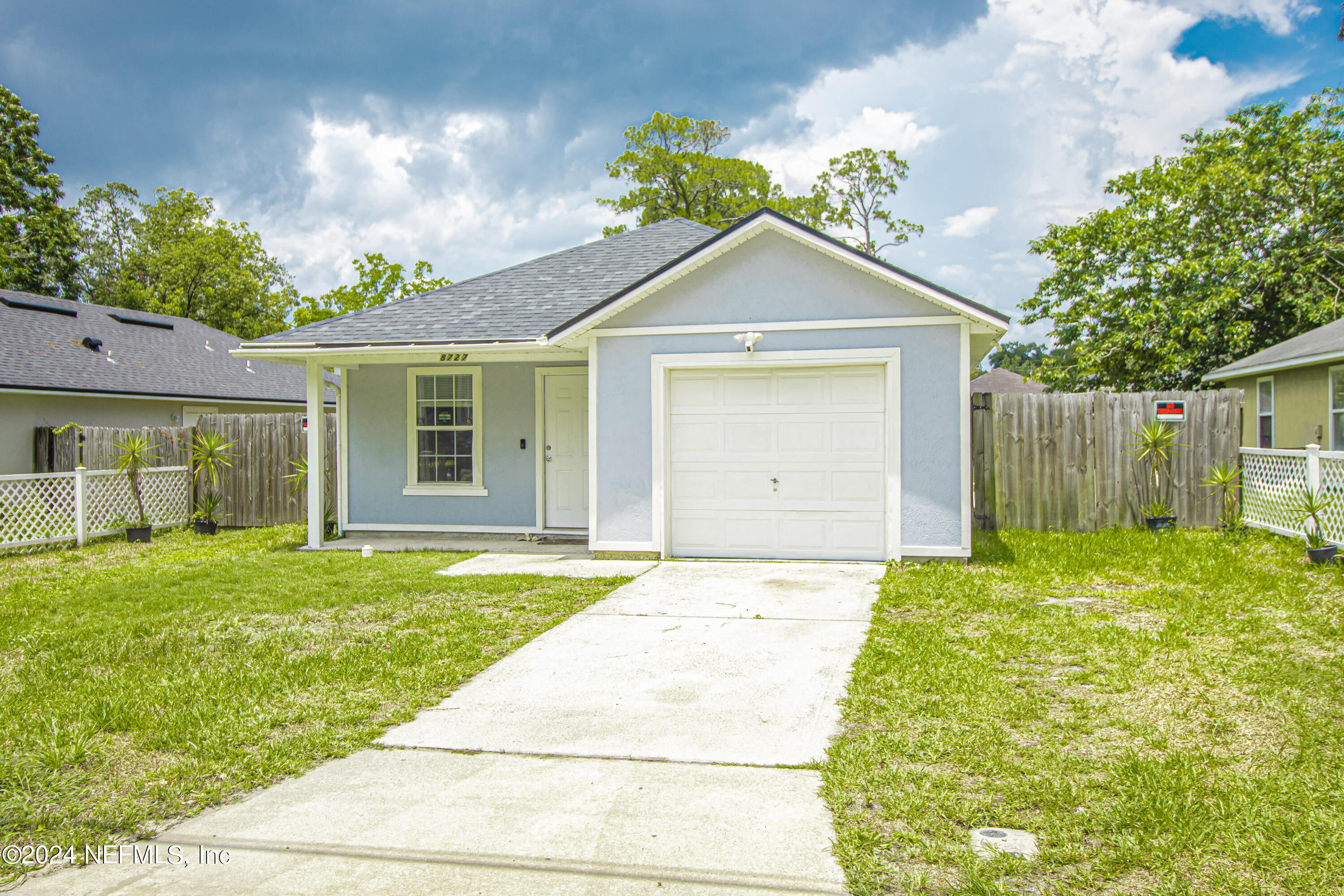 a front view of a house with a yard