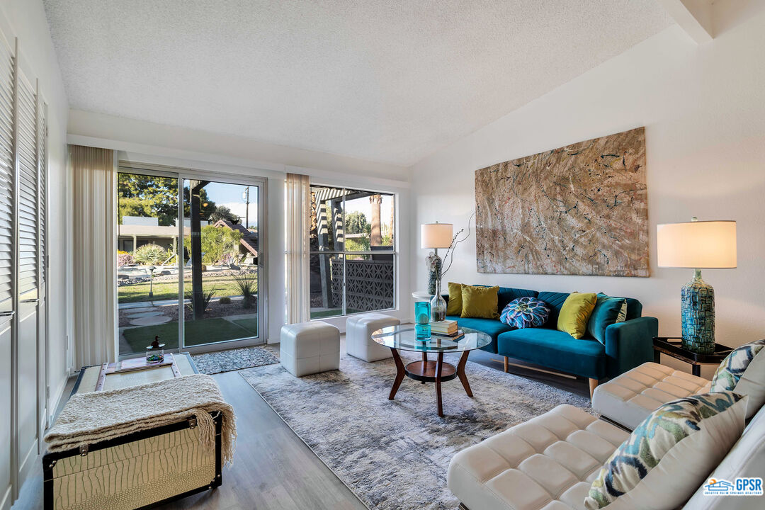 a living room with furniture and a large window