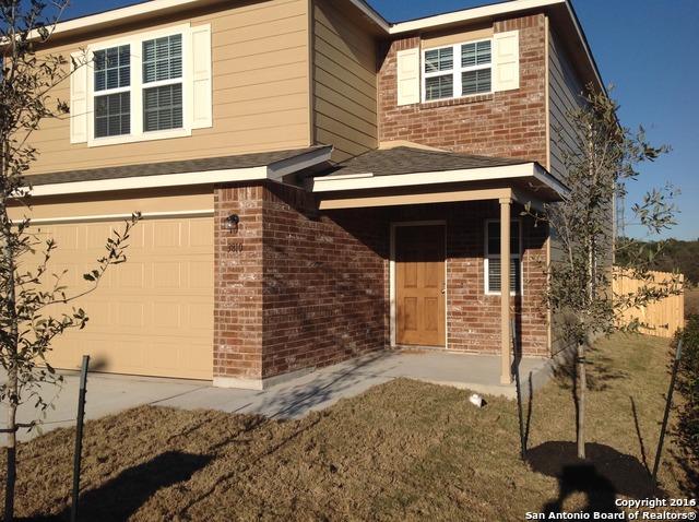 a front view of a house with parking