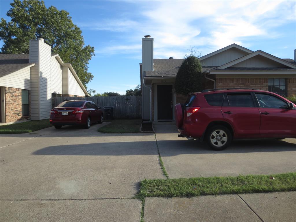 a car parked in front of a house