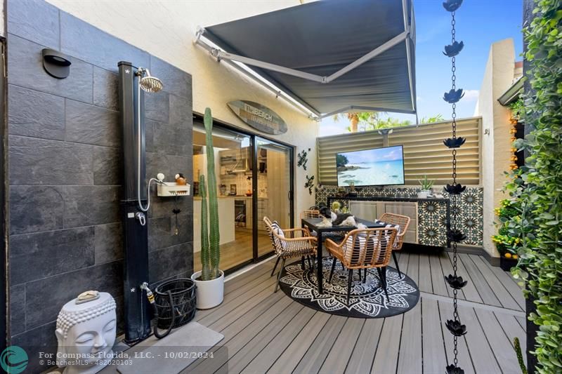 a view of a chairs and table in the patio