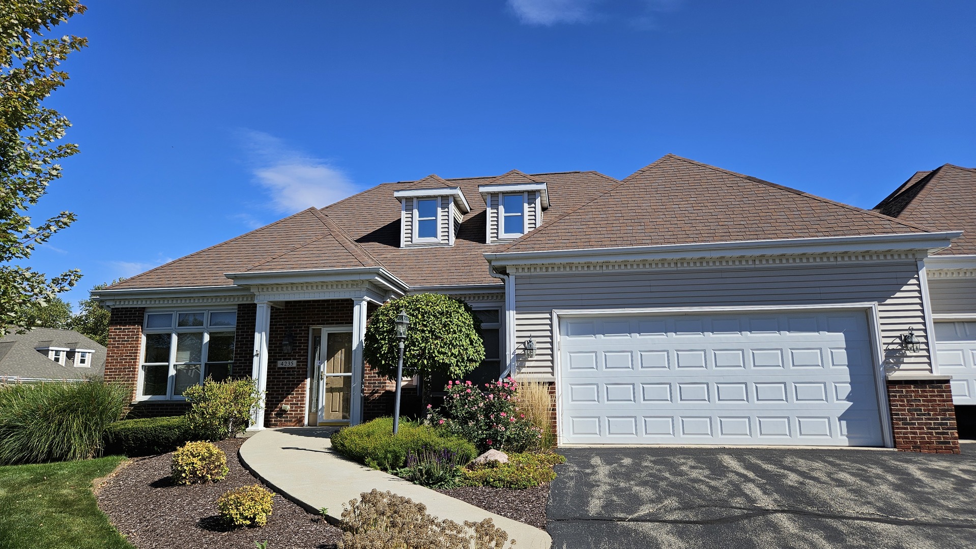 a front view of a house with garden